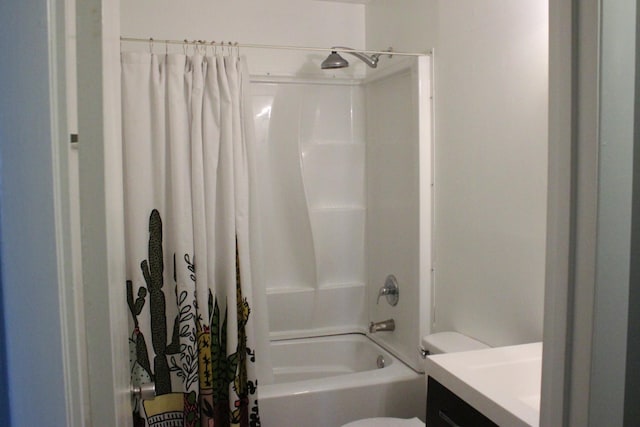 bathroom featuring shower / bathtub combination with curtain, toilet, and vanity