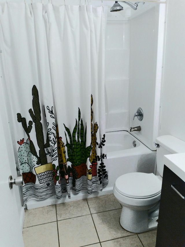 bathroom with toilet, tile patterned flooring, shower / bathtub combination with curtain, and vanity