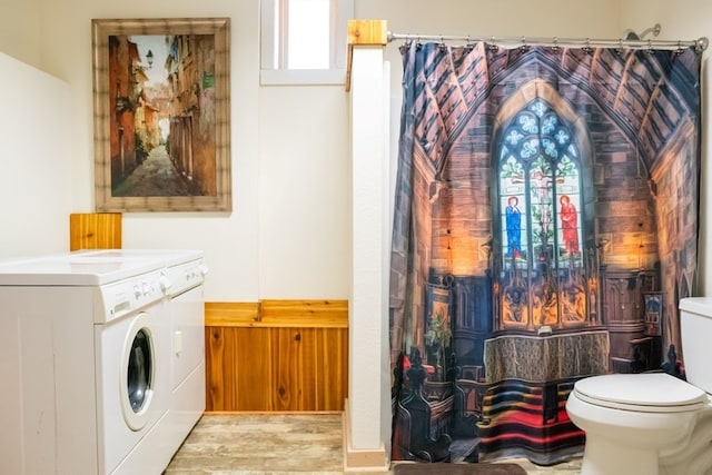 interior space with washing machine and dryer and light wood-type flooring