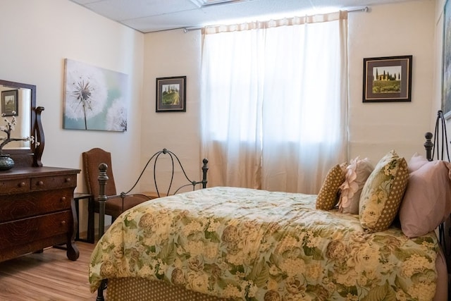 bedroom with hardwood / wood-style flooring