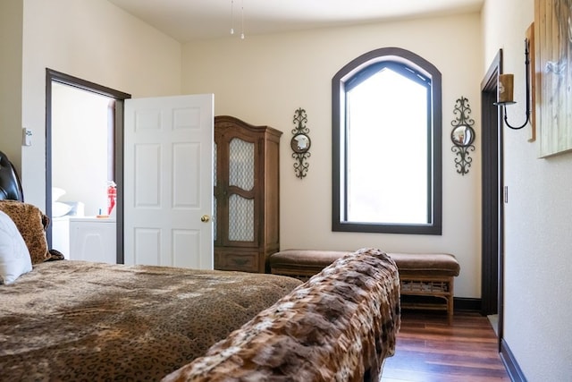 bedroom featuring dark wood-type flooring