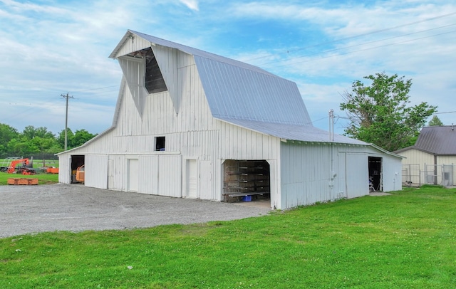 view of outbuilding with a yard