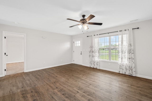 unfurnished room with ceiling fan and hardwood / wood-style flooring