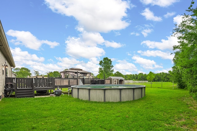 view of yard featuring a swimming pool side deck and a gazebo