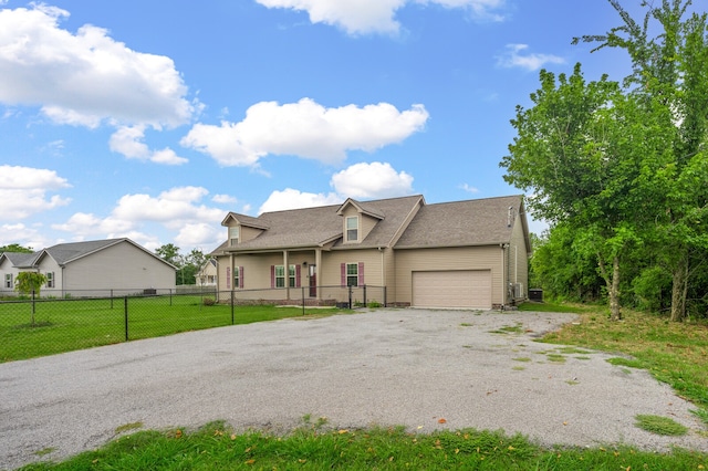 view of front facade with a garage and a front yard