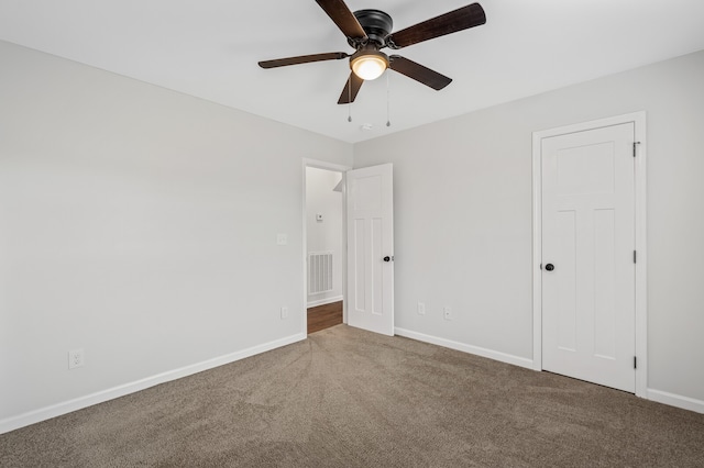 unfurnished bedroom featuring carpet flooring and ceiling fan