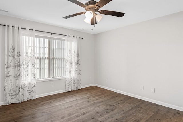 spare room with ceiling fan, hardwood / wood-style flooring, and a healthy amount of sunlight