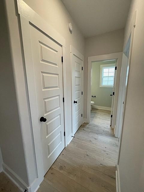 hallway featuring light hardwood / wood-style flooring