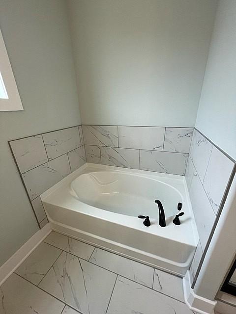 bathroom featuring a bathing tub