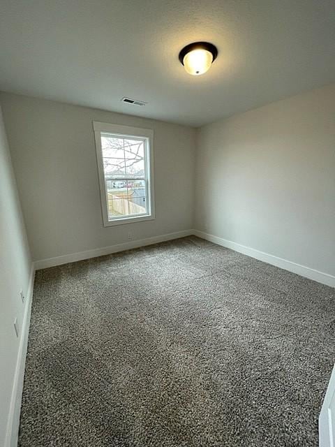 spare room with carpet flooring