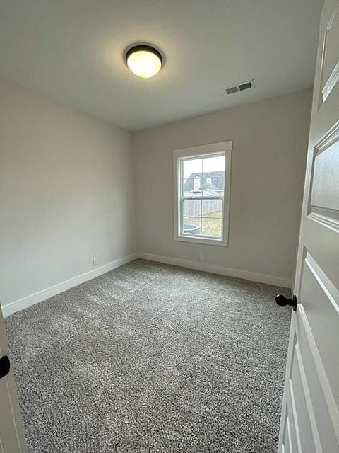 empty room with carpet flooring