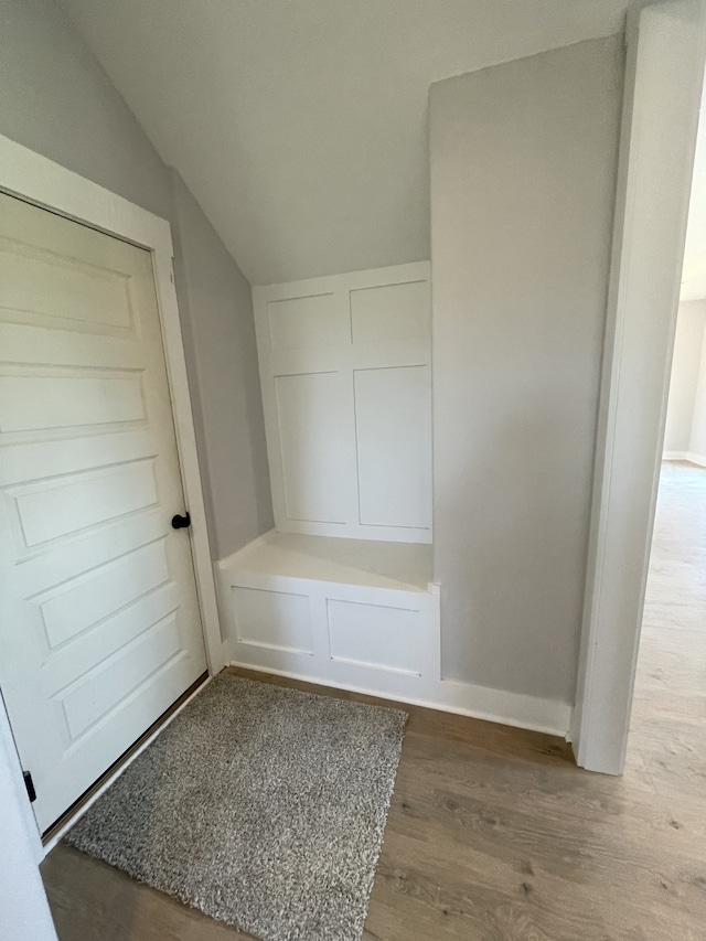 mudroom with hardwood / wood-style flooring and lofted ceiling