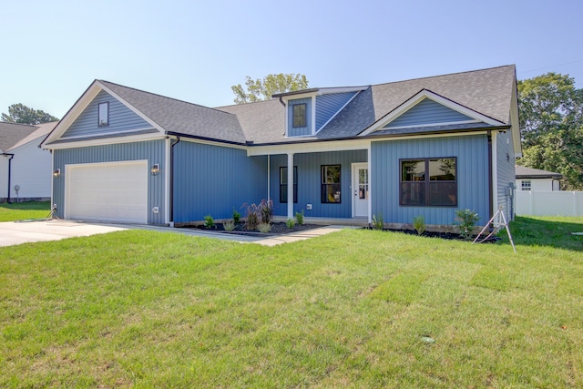 view of front of home featuring a front lawn and a garage