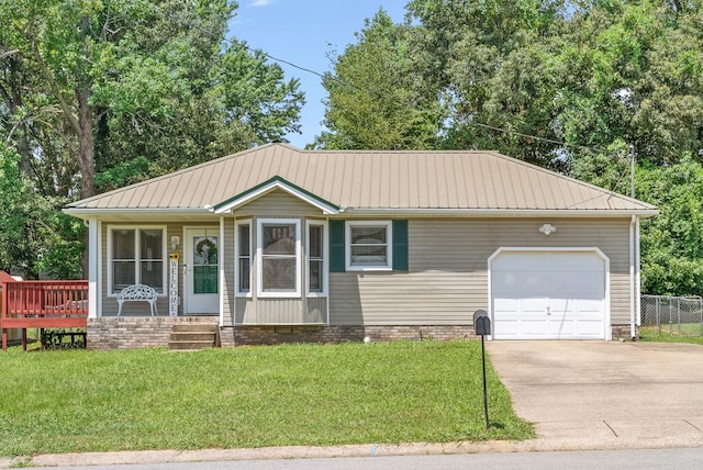 view of front facade featuring a garage, a front yard, and a porch