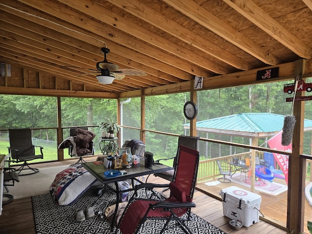 sunroom with vaulted ceiling and ceiling fan