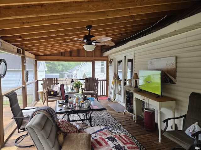 sunroom with vaulted ceiling and ceiling fan