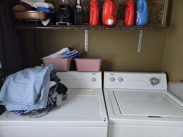 washroom featuring washer and clothes dryer