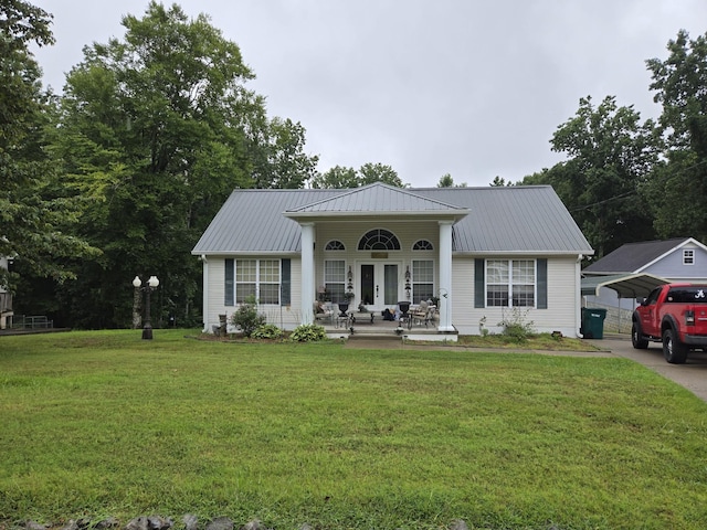 view of front facade with a front yard, a carport, and a porch