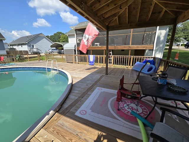 view of swimming pool featuring a deck