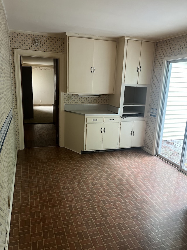 kitchen featuring white cabinets