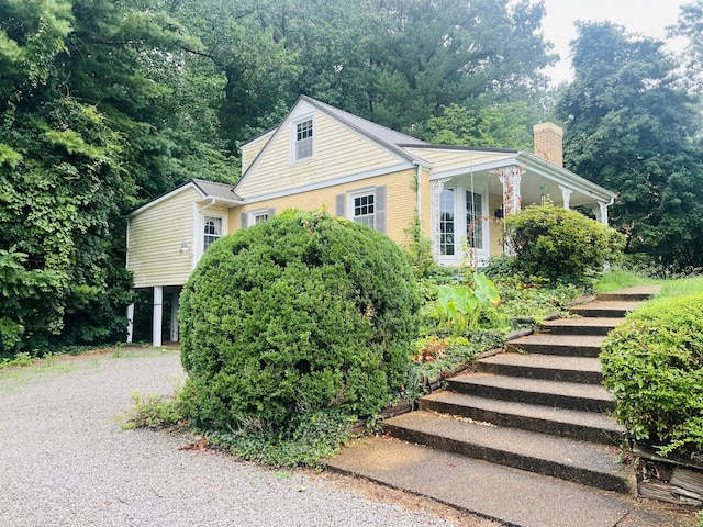 view of side of property featuring a porch