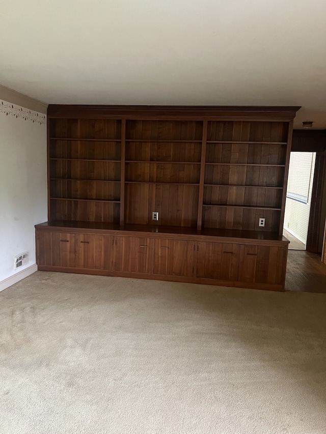 unfurnished living room featuring carpet floors