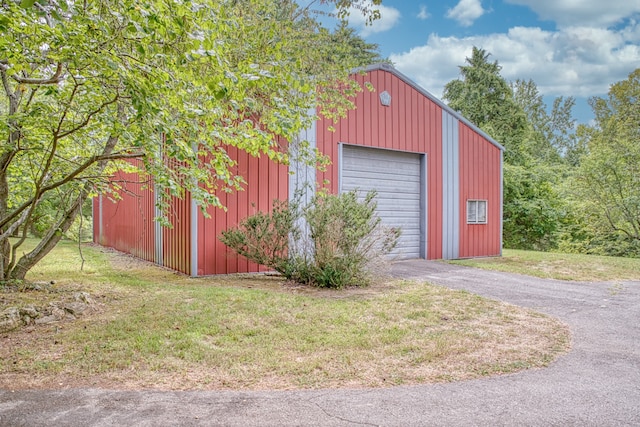 garage featuring a yard