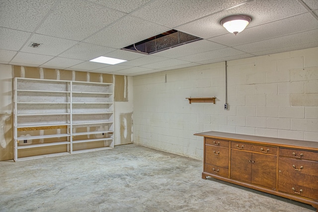 basement featuring a drop ceiling