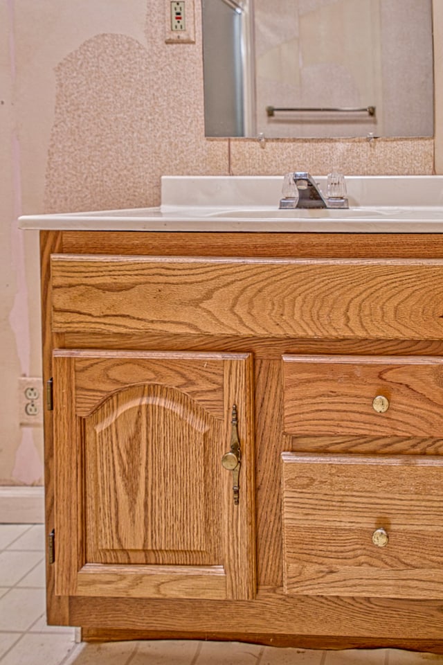 room details featuring vanity and tile patterned floors