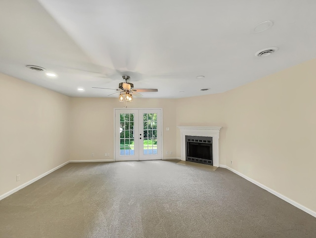 unfurnished living room featuring carpet floors, french doors, and ceiling fan