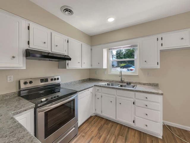 kitchen featuring white dishwasher, sink, white cabinetry, and stainless steel range with electric cooktop