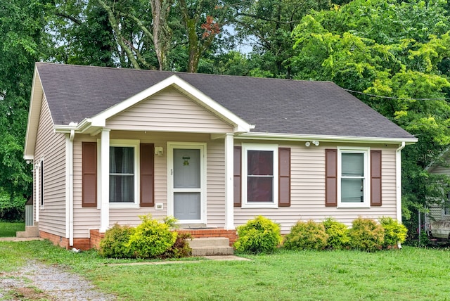 view of front of home with a front yard