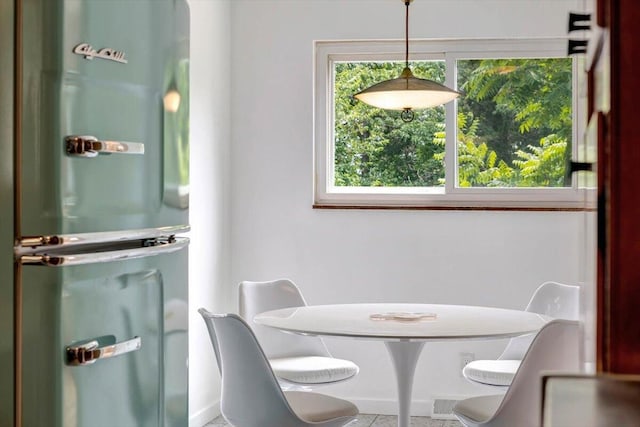 dining space featuring tile patterned flooring