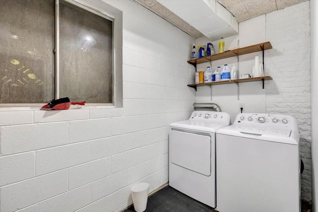 laundry room featuring washing machine and clothes dryer