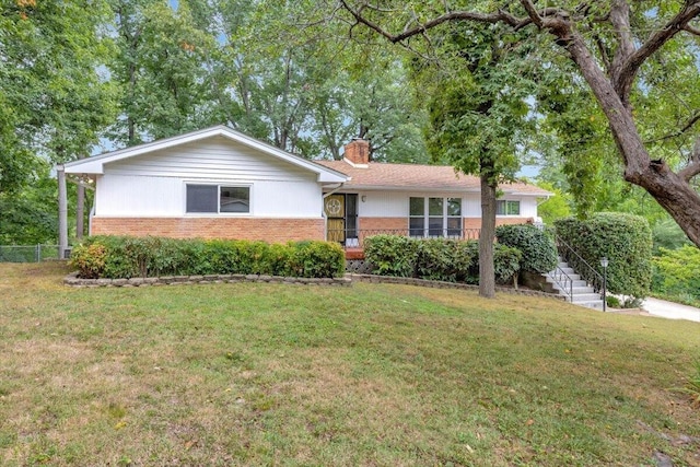 ranch-style home with a front lawn