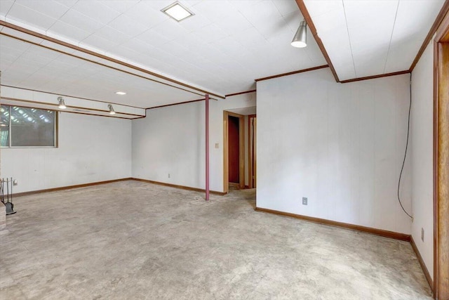 basement featuring crown molding and light colored carpet