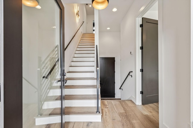 stairway with wood-type flooring