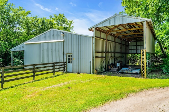 view of outdoor structure featuring a yard