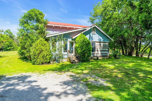 view of home's exterior featuring a yard