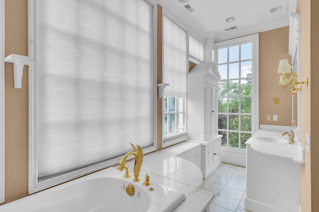 bathroom featuring tile patterned flooring, a tub to relax in, a wealth of natural light, and vanity