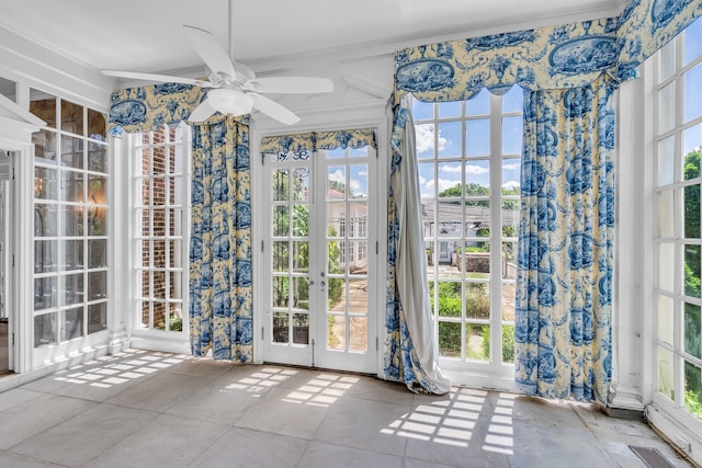 interior space featuring ornamental molding, ceiling fan, french doors, and tile patterned flooring