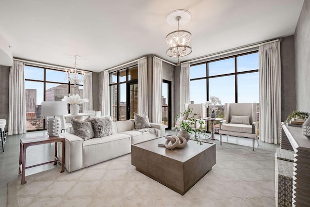 living room with expansive windows and an inviting chandelier