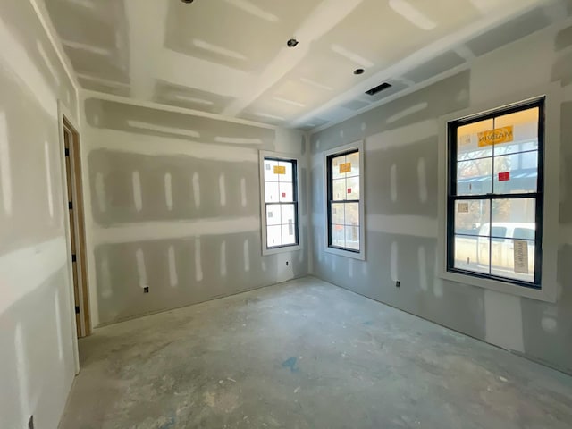 unfurnished room with concrete floors