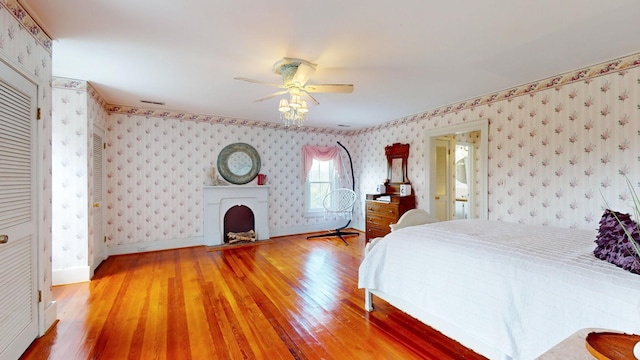 bedroom with hardwood / wood-style flooring and ceiling fan