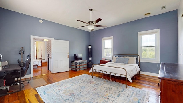 bedroom featuring ceiling fan and hardwood / wood-style floors