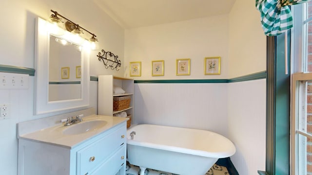 bathroom featuring vanity and a tub