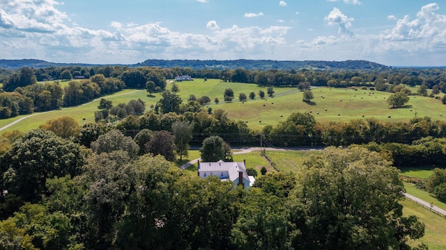 birds eye view of property with a rural view