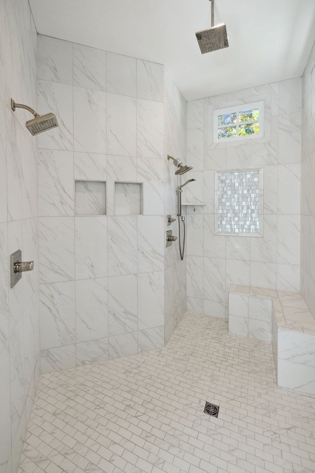 bathroom featuring tiled shower