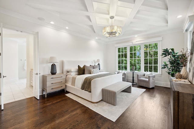 bedroom featuring beam ceiling, an inviting chandelier, dark wood-type flooring, crown molding, and coffered ceiling