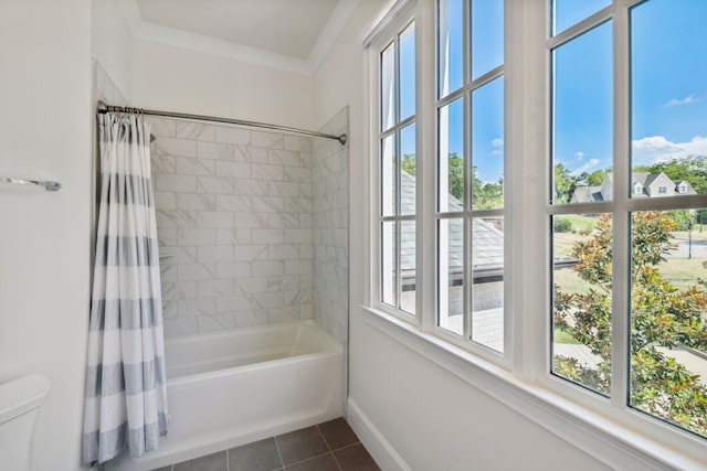 bathroom with shower / bath combination with curtain, toilet, a healthy amount of sunlight, and tile patterned flooring